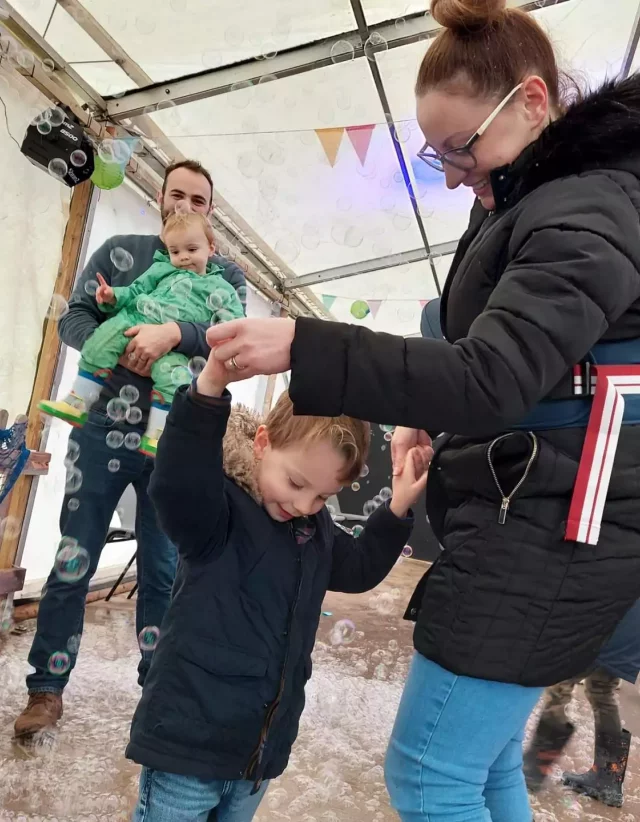 A family enjoying the Bubbles & Boogie event