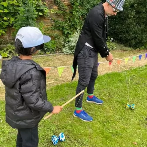 A child trying a circus skills activity