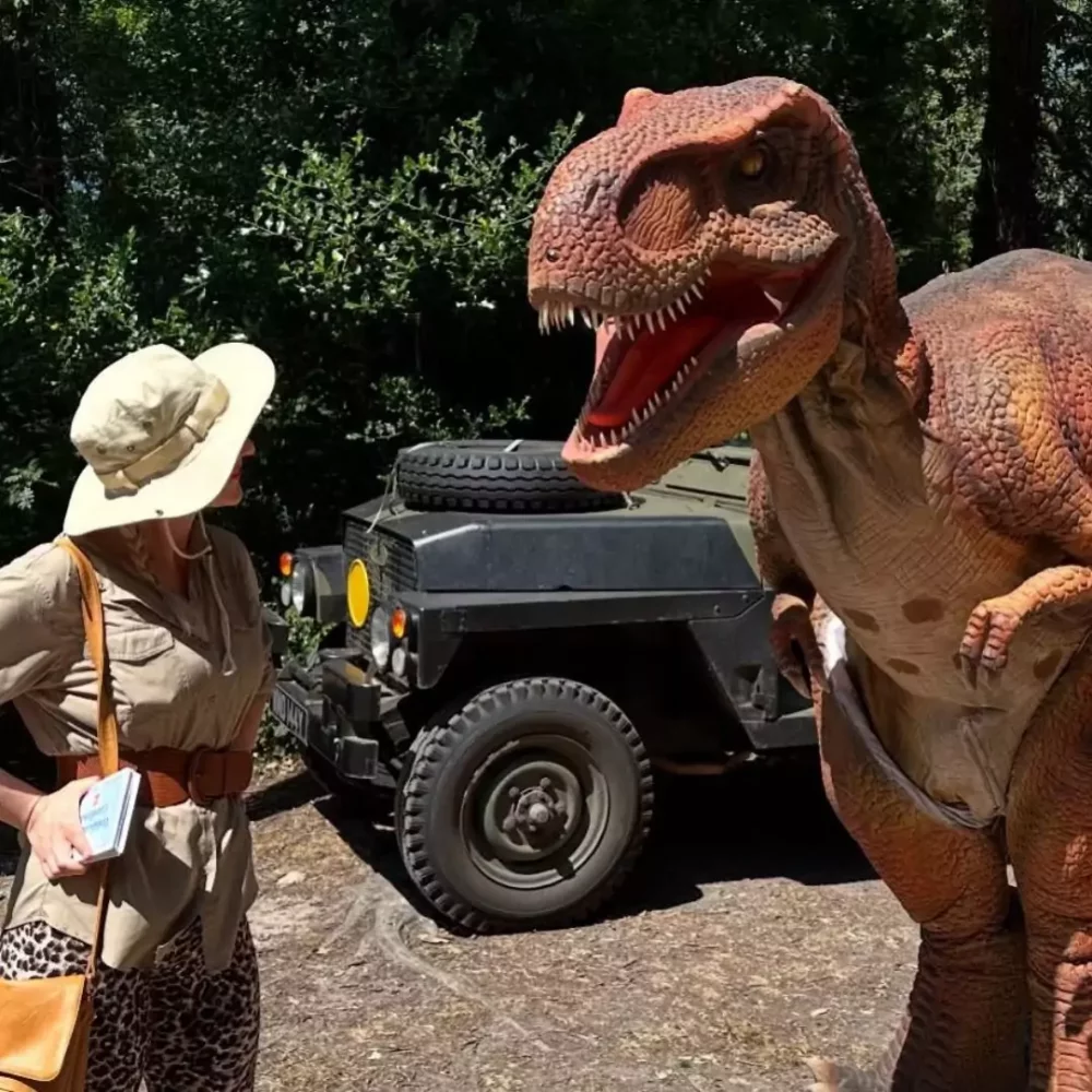 A giant T. rex and presenter in the Dinosaur Timewarp Show