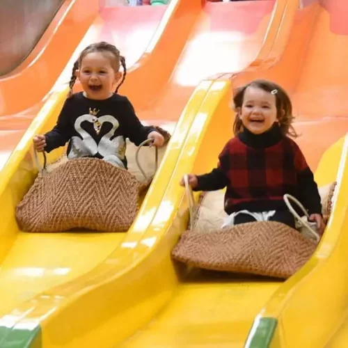 Children riding the indoor slides