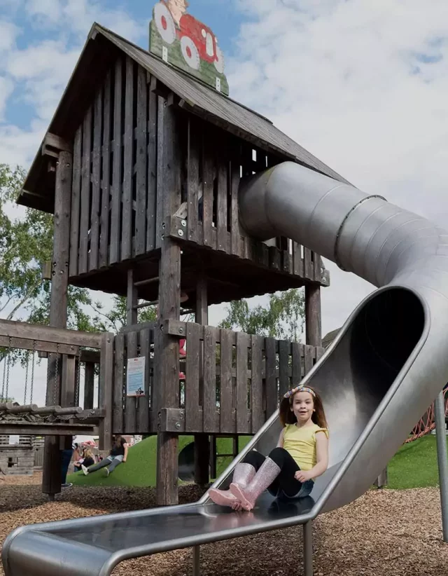 Outdoor adventure play tower and slides