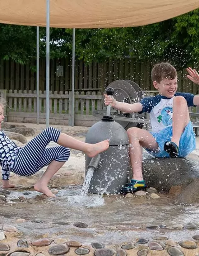 Children playing in the outdoor sand play area